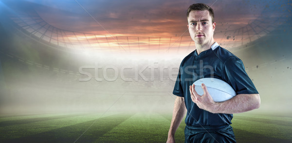 Composite image of rugby player holding a rugby ball Stock photo © wavebreak_media