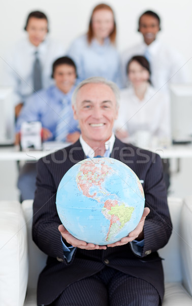 Senior manager holding a terrestrial globe Stock photo © wavebreak_media