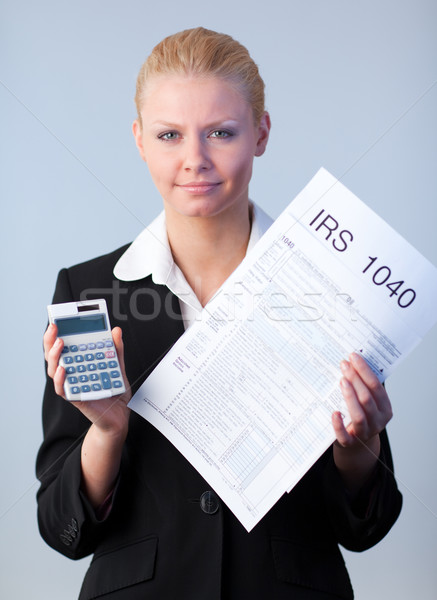 заполнение налоговых деловой женщины глядя компьютер бумаги Сток-фото © wavebreak_media