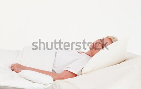Stock photo: Senior patient lying on a medical bed