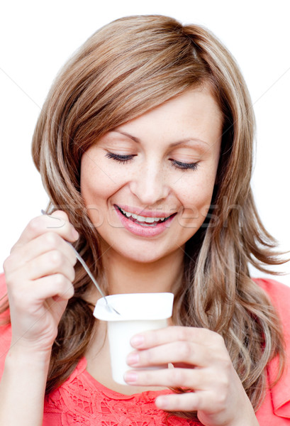 Radiant woman eating a yogurt  Stock photo © wavebreak_media
