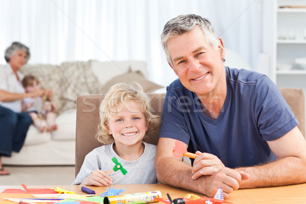 Little boy drawing with his grand father at home Stock photo © wavebreak_media