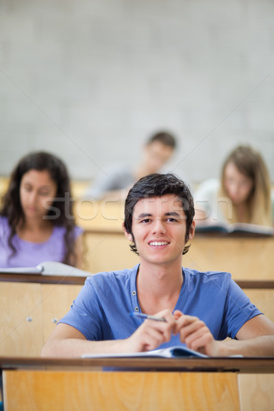 Portrait of focused students during a lecture with the camera focus on the foreground Stock photo © wavebreak_media