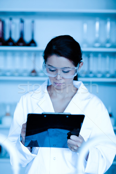 Portrait of a scientist taking notes in a laboratory Stock photo © wavebreak_media