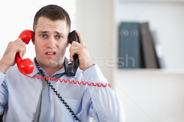 Close up of stressed businessman unable to cope with the telephone Stock photo © wavebreak_media