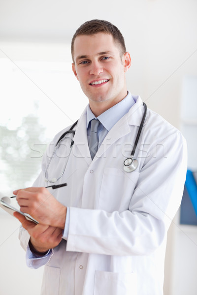 Stock photo: Close up of smiling doctor ready to take notes