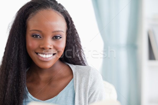 Közelkép mosolyog fiatal nő otthon pihen társalgó Stock fotó © wavebreak_media