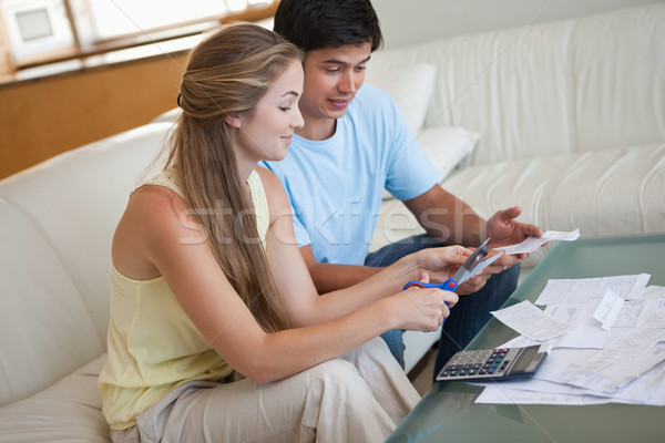 Couple cutting their credit card in their living room Stock photo © wavebreak_media