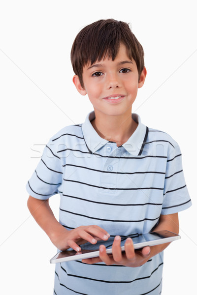 Portrait of a cute little boy using a tablet computer against a white background Stock photo © wavebreak_media