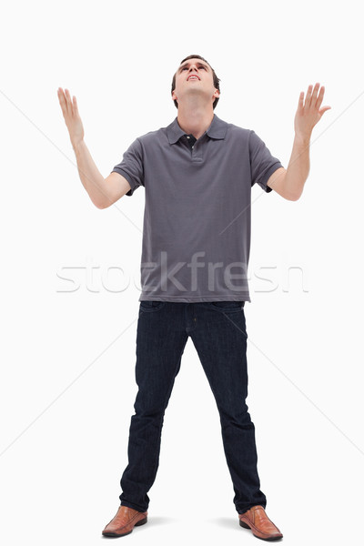 Man looking up to the heavens against white background Stock photo © wavebreak_media