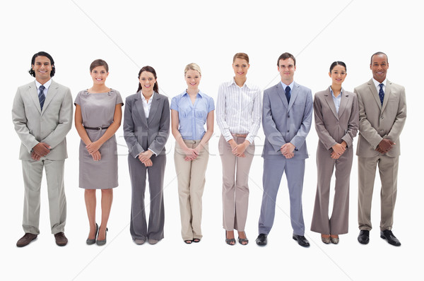 Business team side by side holding their hands against white background Stock photo © wavebreak_media