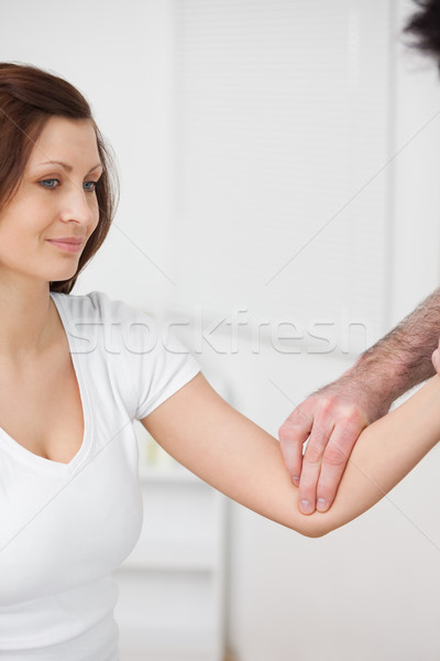 Close-up of a smiling woman being examined by a doctor in a room Stock photo © wavebreak_media