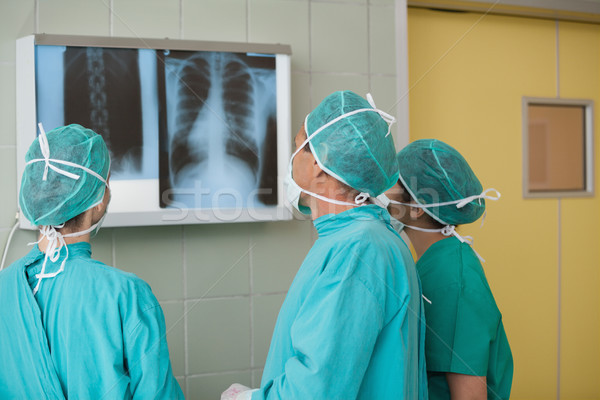Medical team looking at a X-ray in operating theater Stock photo © wavebreak_media