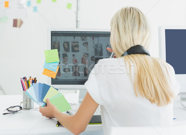 Rear view of a casual woman using computer in office Stock photo © wavebreak_media