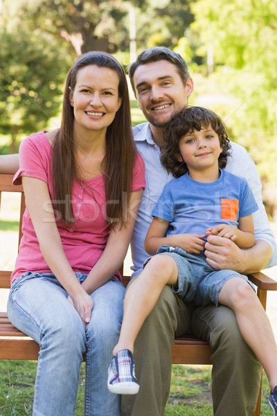 улыбаясь пару сын сидят парка скамейке Сток-фото © wavebreak_media