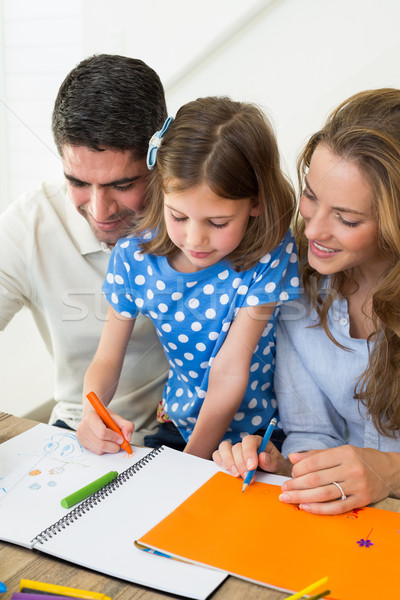 Parents and daughter coloring Stock photo © wavebreak_media