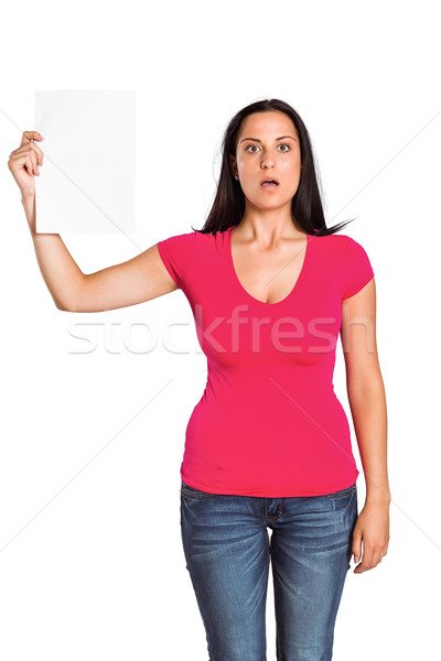 Shocked woman holding piece of paper Stock photo © wavebreak_media