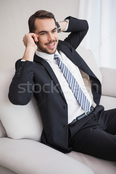 Businessman making a call on his couch Stock photo © wavebreak_media