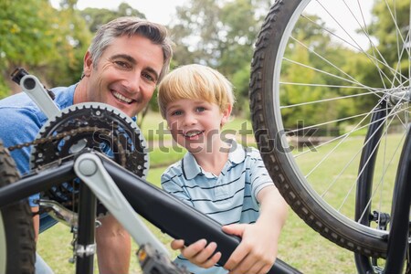 Father and son repairing bike Stock photo © wavebreak_media