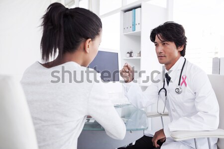 Doctor talking with upset looking patient Stock photo © wavebreak_media