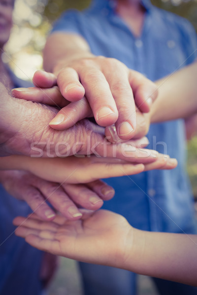 Family putting their hands together Stock photo © wavebreak_media