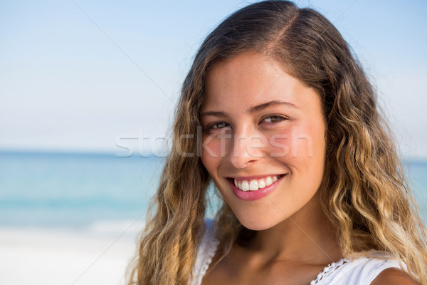 Stock photo: Portrait of beautiful smiling woman at beach