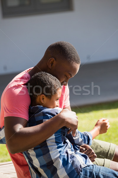 Father embracing his son in the backyard Stock photo © wavebreak_media