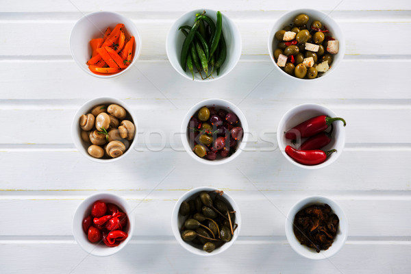 Marinated olives and vegetables on white background Stock photo © wavebreak_media