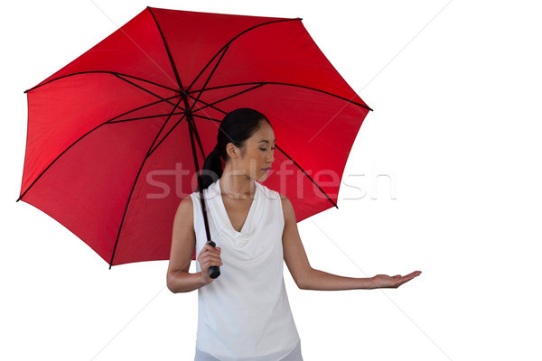 Young woman holding umbrella Stock photo © wavebreak_media