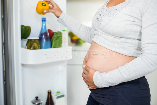 Stock fotó: Terhes · nő · tart · has · bors · hűtőszekrény · megérint