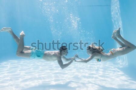 Stock photo: Smiling couple under water