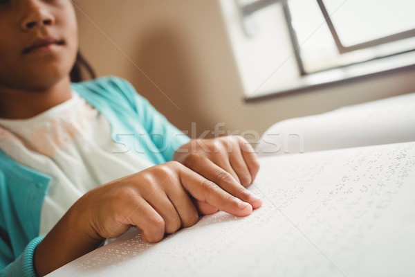 Girl using braille to read Stock photo © wavebreak_media
