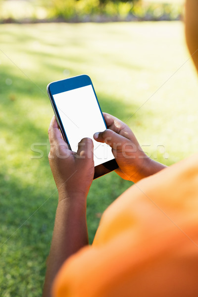 Kid smartphone parc printemps herbe [[stock_photo]] © wavebreak_media