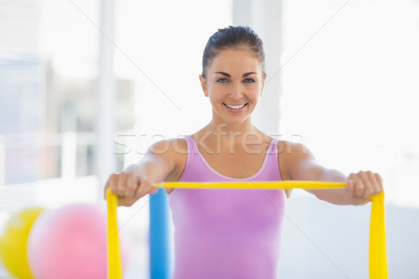 Portré boldog nő ellenállás zenekar testmozgás Stock fotó © wavebreak_media