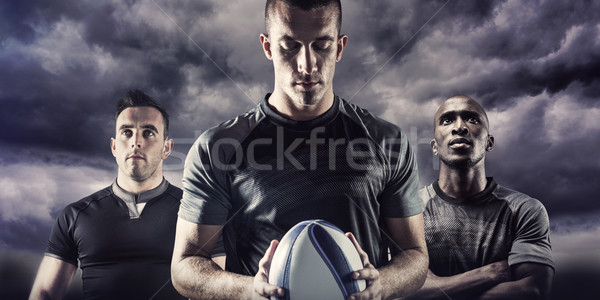 Composite image of thoughtful rugby player holding ball Stock photo © wavebreak_media