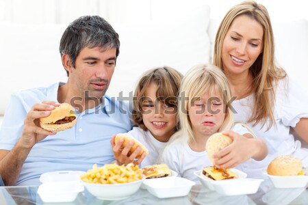 Joyful family eating hamburgers  Stock photo © wavebreak_media