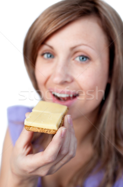 Charming woman eating a cracker with cheese  Stock photo © wavebreak_media