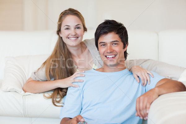 Smiling couple watching television in their living room Stock photo © wavebreak_media