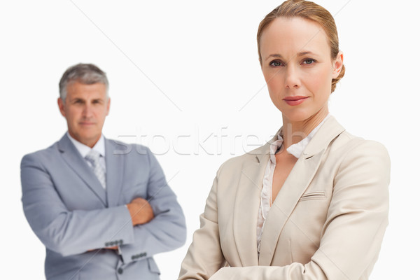 Serious business people with folded arms against white background Stock photo © wavebreak_media