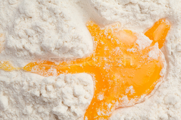 Egg yolk on the flour Stock photo © wavebreak_media