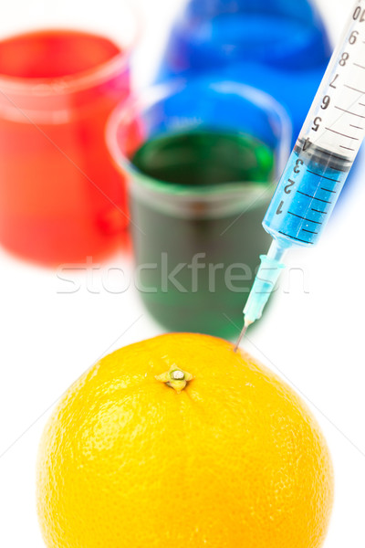 Syringe pricking a lemon against a white background Stock photo © wavebreak_media
