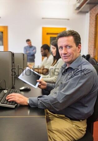 Enseignants écrit presse-papiers salle informatique classe collège [[stock_photo]] © wavebreak_media