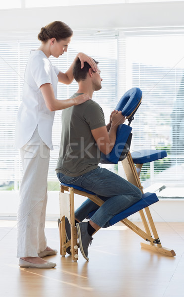 Therapist massaging man in hospital Stock photo © wavebreak_media