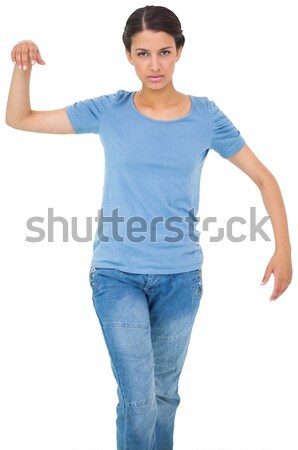 Powerless brunette in jeans and tshirt Stock photo © wavebreak_media