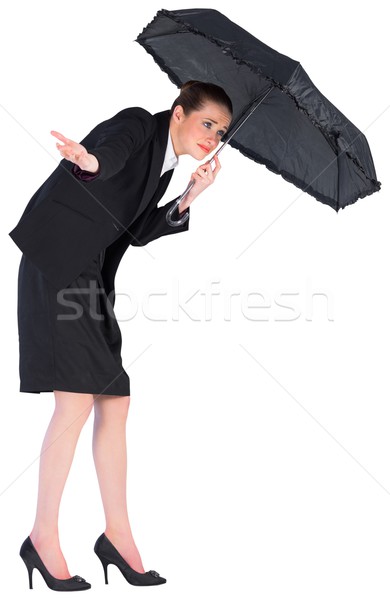 Businesswoman holding a black umbrella Stock photo © wavebreak_media