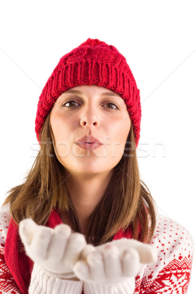 Happy brunette blowing over hands Stock photo © wavebreak_media