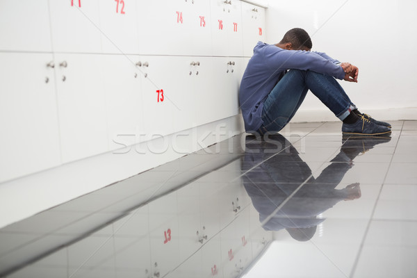 Solitary university student sitting on the floor Stock photo © wavebreak_media