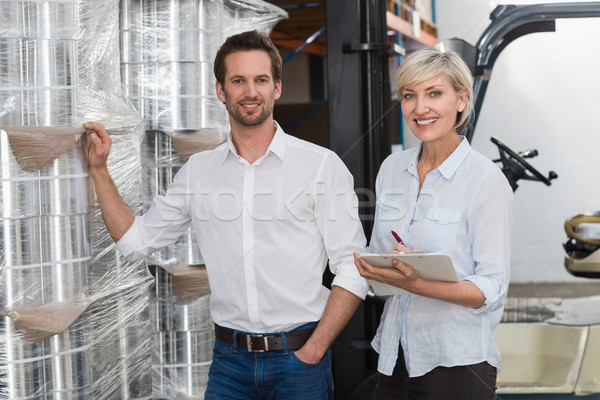 Smiling warehouse managers checking inventory Stock photo © wavebreak_media