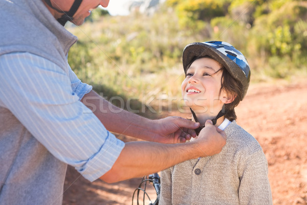 Father clipping on sons helmet  Stock photo © wavebreak_media