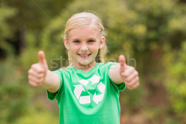 Happy little girl in green with thumbs up  Stock photo © wavebreak_media
